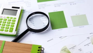 calculator-magnifying-glass-table
